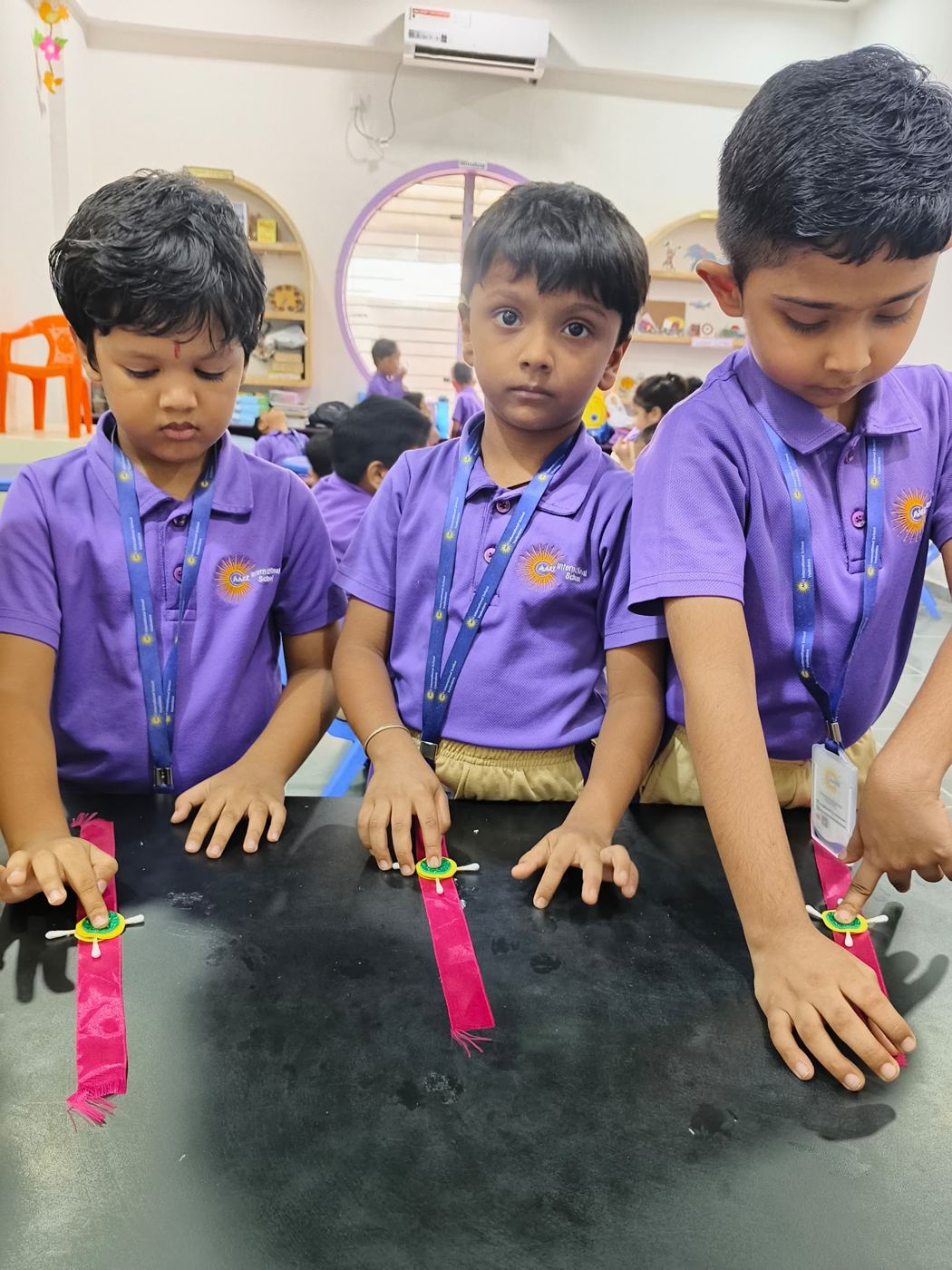 Young children exploring materials at a sensory table